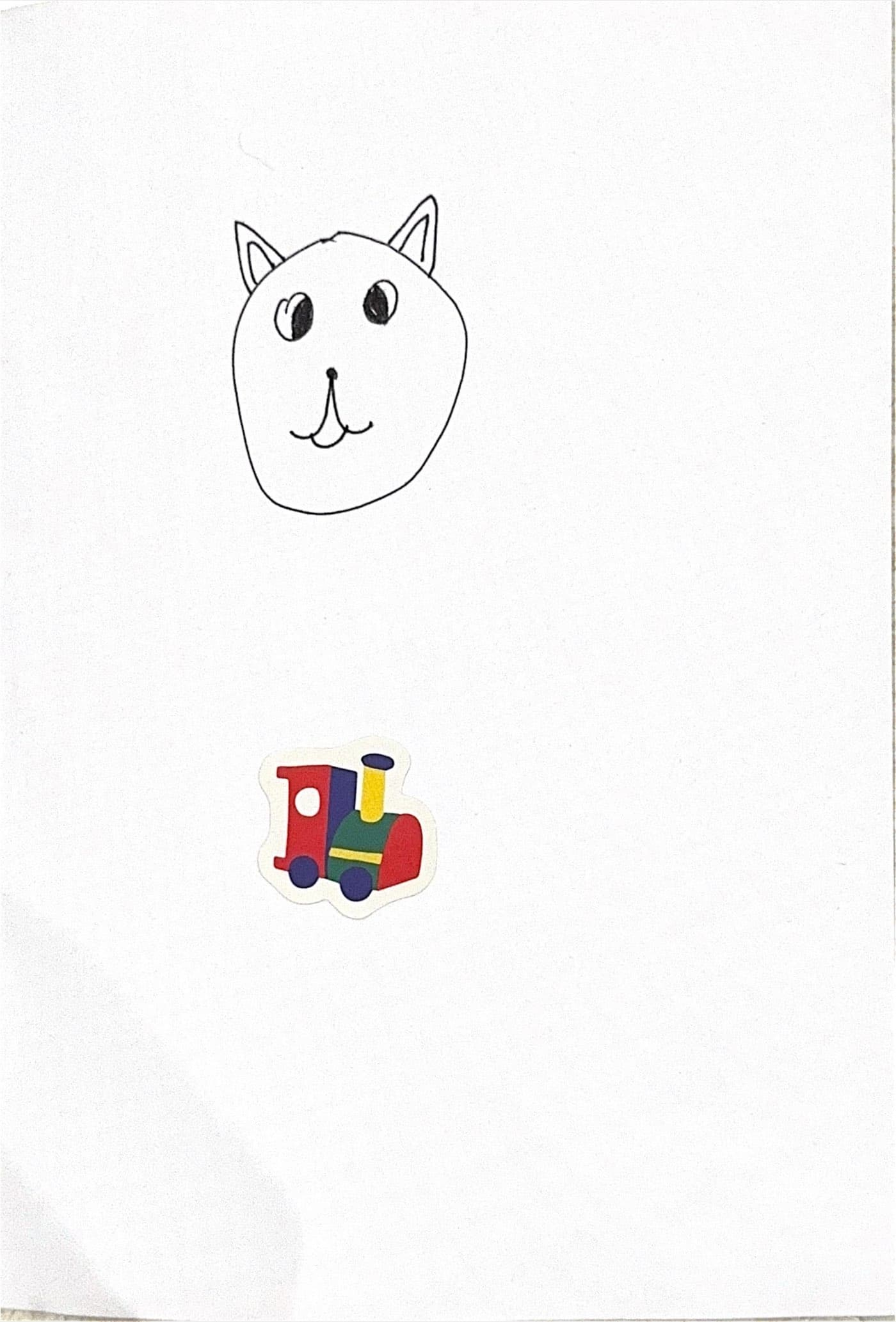 Merciha's drawing of Coco's face above a colourful toy train sticker